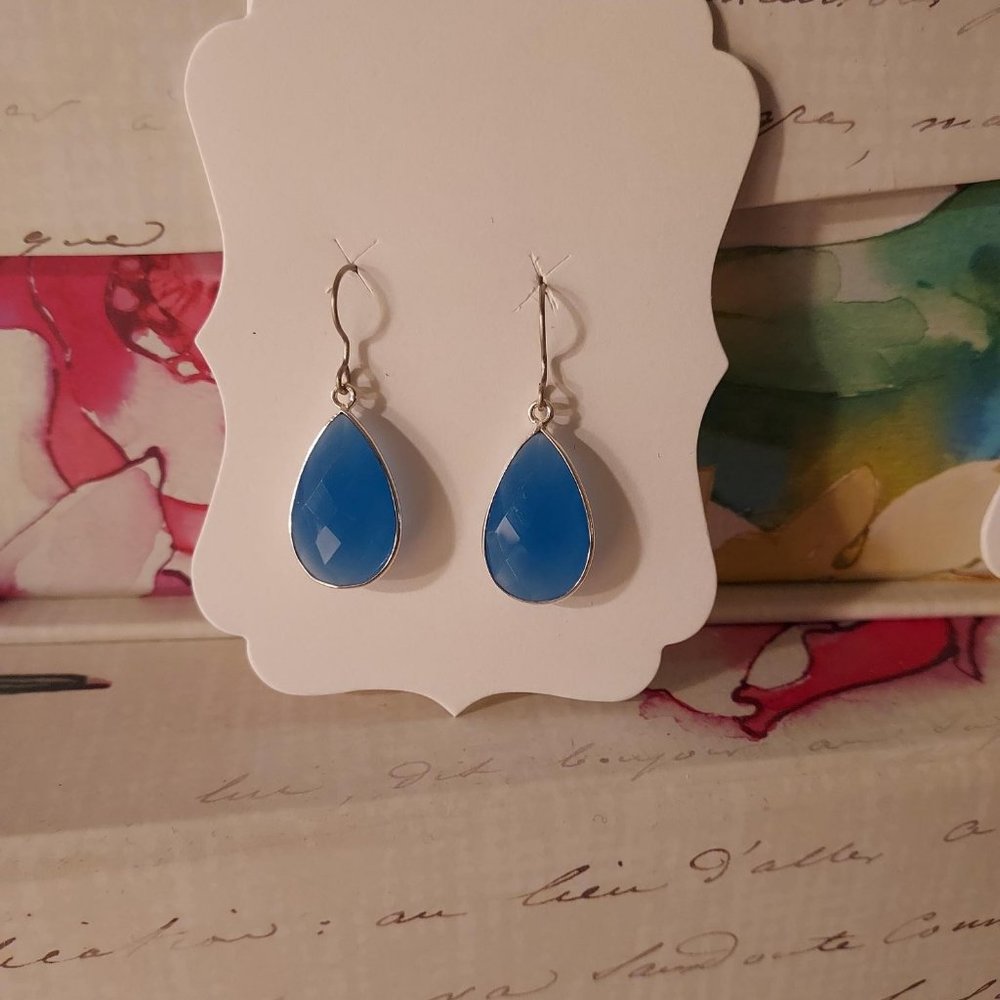 Blue chalcedony drop earrings with silvertone surround and niobium wires